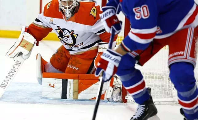 Anaheim Ducks goaltender Lukas Dostal (1) defends against New York Rangers left wing Will Cuylle (50) during the second period of an NHL hockey game, Monday, Dec 15, 2025, in New York. (AP Photo/Noah K. Murray)