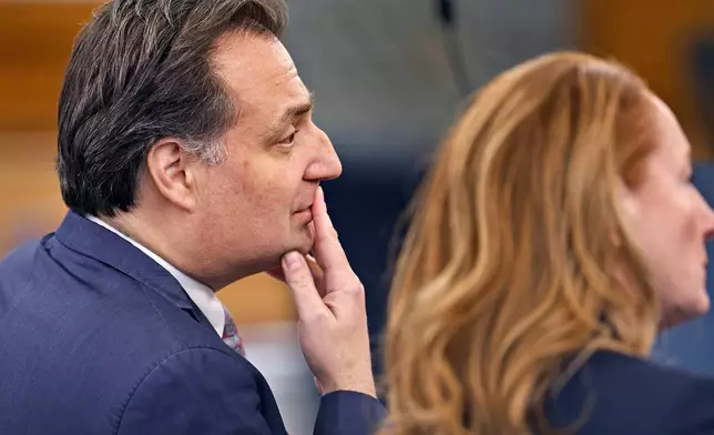 Brian Walshe looks at the jury while seated with his attorney Kelli Porges in Norfolk Superior Court on Monday, Dec. 15, 2025 in Dedham, Mass. (Greg Derr/The Patriot Ledger via AP, Pool)
