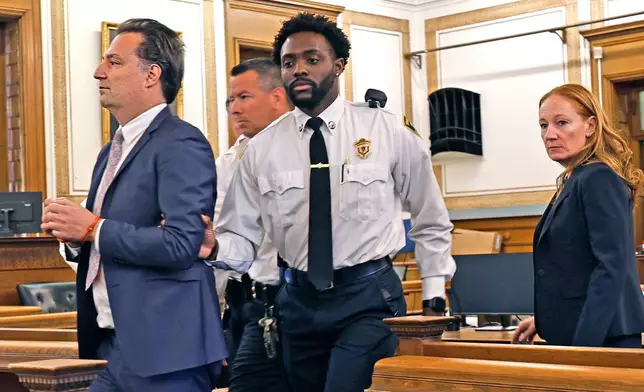 Brian Walshe, left, is escorted out of court after being found guilty of the first degree murder of his wife Ana in 2023 by a Norfolk Superior Court jury in Dedham, Mass., on Monday, Dec. 15, 2025. (Greg Derr/The Patriot Ledger via AP, Pool)