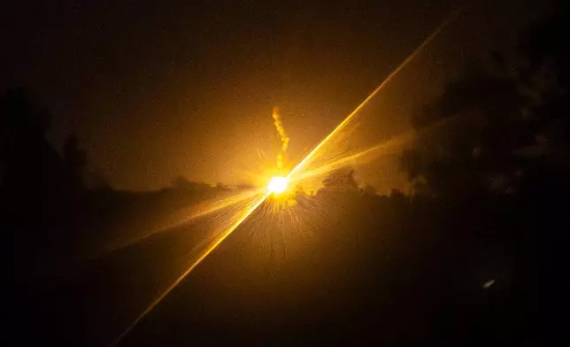 Illumination flares fired by Thai military forces shine in Burirum province, Thailand, Wednesday, Dec. 10, 2025, following clashes between Thai and Cambodian soldiers. (AP Photo/Wason Wanichakorn)