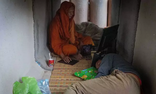 Thai residents, who fled clashes between Thai and Cambodian soldiers, takes shelter in Buriram province, Thailand, Tuesday, Dec. 9, 2025. (AP Photo/Wason Wanichakorn)