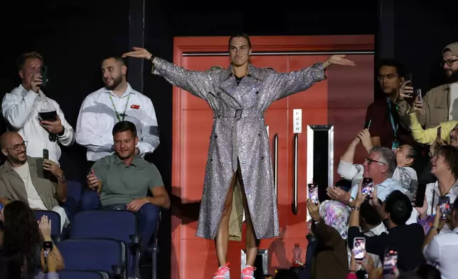 Aryna Sabalenka makes her way to the court for the Battle of the Sexes match between Aryna Sabalenka and Nick Kyrgios in Dubai, United Arab Emirates, Sunday Dec. 28, 2025. (Amr Alfiky/Pool Photo via AP)