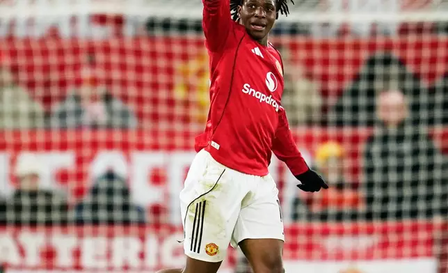 Manchester United's Patrick Dorgu celebrates after scoring the opening goal during the English Premier League soccer match between Manchester United and Newcastle in Manchester, England, Friday, Dec. 26, 2025. (AP Photo/Dave Thompson)