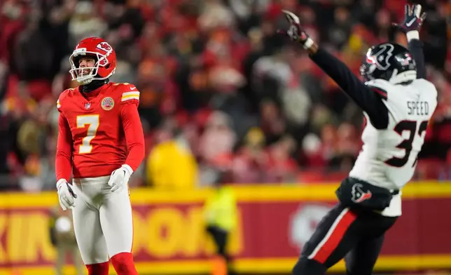 Houston Texans cornerback Ameer Speed (37) reacts to Kansas City Chiefs kicker Harrison Butker (7) missing a field goal attempt during the first half of an NFL football game Sunday, Dec. 7, 2025, in Kansas City, Mo. (AP Photo/Charlie Riedel)