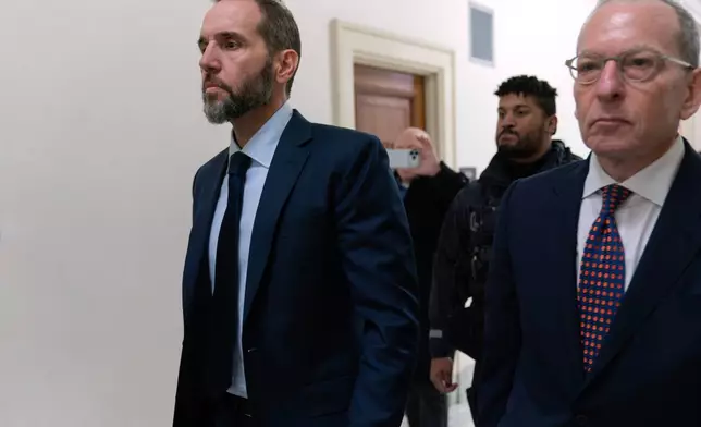 Former Department of Justice Special Counsel Jack Smith, left, and his attorney Lanny Breuer arrive for a closed-door interview with House Republicans at Capitol Hill, Wednesday, Dec. 17, 2025, in Washington. (AP Photo/Jose Luis Magana)