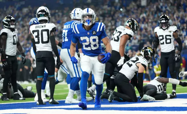 Indianapolis Colts running back Jonathan Taylor (28) celebrates after scoring during the first half of an NFL football game against the Jacksonville Jaguars Sunday, Dec. 28, 2025, in Indianapolis. (AP Photo/AJ Mast)