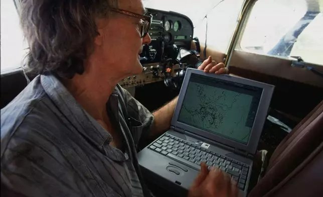 FILE - Dr. Iain Douglas-Hamilton checks on his laptop computer the position of an elephant fitted with a Global Positioning System (GPS) beacon in the Meru National Park, Kenya, May 21, 1998. (AP Photo/Jean-Marc Bouju, File)