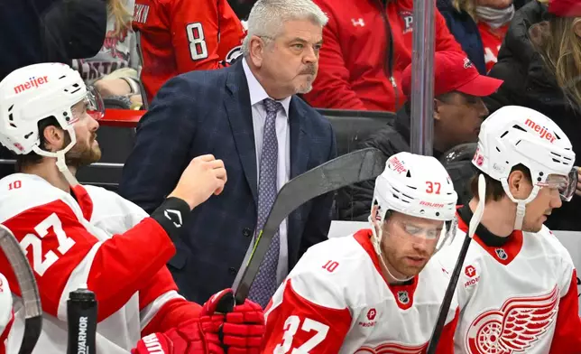 Detroit Red Wings head coach Todd McLellan watches the action from the bench during the first period of an NHL hockey game against the Washington Capitals, Saturday, Dec. 20, 2025, in Washington. (AP Photo/John McDonnell)