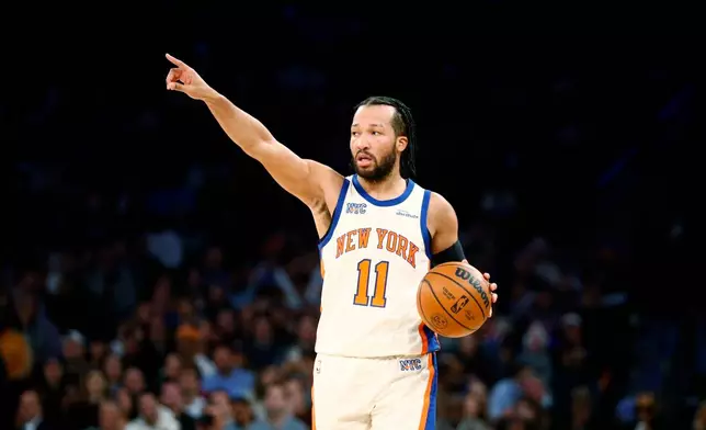 New York Knicks guard Jalen Brunson takes the ball upcourt during the first half of an NBA basketball game against the Orlando Magic, Sunday, Dec. 7, 2025, in New York. (AP Photo/John Munson)