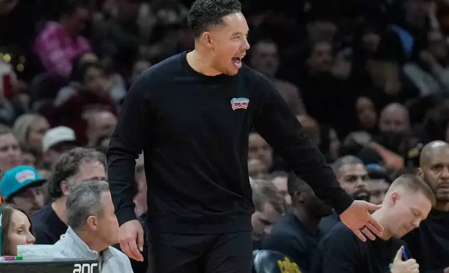 San Antonio Spurs head coach Mitch Johnson gestures in the second half of an NBA basketball game against the Cleveland Cavaliers Friday, Dec. 5, 2025, in Cleveland. (AP Photo/Sue Ogrocki)
