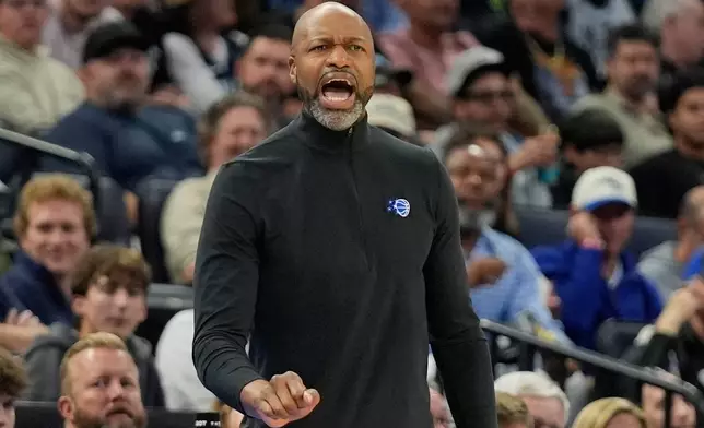 Orlando Magic head coach Jamahl Mosley shouts to players during the first half of an NBA basketball game against the San Antonio Spurs, Wednesday, Dec. 3, 2025, in Orlando, Fla. (AP Photo/John Raoux)