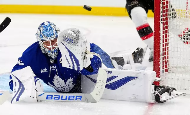 Ottawa Senators right wing Drake Batherson scores on Toronto Maple Leafs goaltender Joseph Woll during the third period of an NHL hockey game in Toronto, Saturday, Dec. 27, 2025. (Frank Gunn/The Canadian Press via AP)