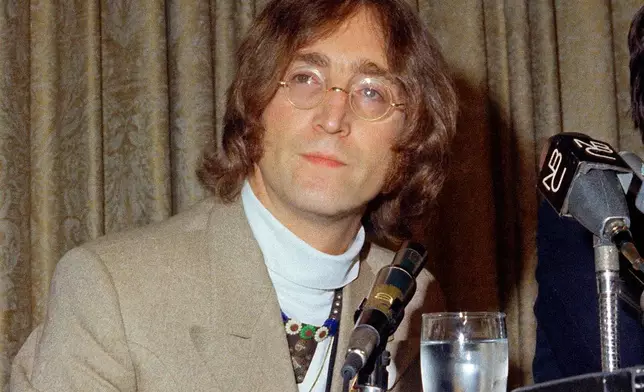 FILE - In this May 13, 1968 file photo, singer John Lennon appears during a press conference at the Hotel Americana in New York. (AP Photo, File)