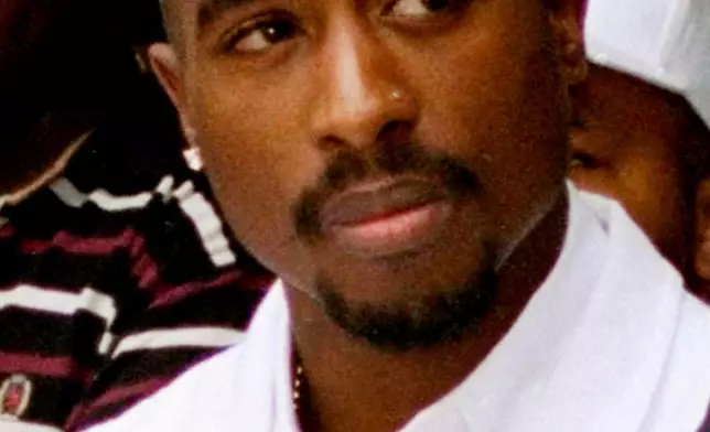 FILE - Rapper Tupac Shakur attends a voter registration event in South Central Los Angeles, Aug. 15, 1996. (AP Photo/Frank Wiese, File)