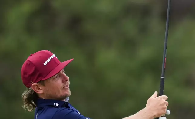Cam Smith of Australia plays an approach shot on the 9th Hole during the first round of the Australian Open golf tournament in Melbourne, Australia, Thursday, Dec. 4, 2025. (AP Photo/Asanka Brendon Ratnayake)