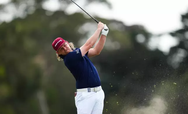 Cam Smith of Australia plays an approach shot on the 18th Hole during the first round of the Australian Open golf tournament in Melbourne, Australia, Thursday, Dec. 4, 2025. (AP Photo/Asanka Brendon Ratnayake)