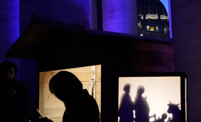 FILE - A Christmas crib scene is displayed at the International Exhibition "100 Nativity Scenes in the Vatican" at St. Peter's Square in Vatican City, Dec. 8, 2025. (AP Photo/Gregorio Borgia, File)