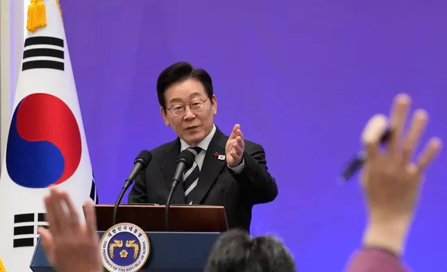 South Korean President Lee Jae Myung gestures during a news conference to mark the first anniversary of the Dec. 3 martial law crisis at the Blue House in Seoul, South Korea, Wednesday, Dec. 3, 2025. (AP Photo/Ahn Young-joon)