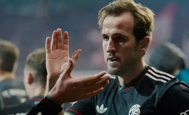 Bayern's Harry Kane celebrates after scoring his side's second goal during the German soccer cup round of sixteen match between 1. FC Union Berlin and FC Bayern Munich in Berlin, Germany, Wednesday, Dec. 3, 2025. (AP Photo/Ebrahim Noroozi)