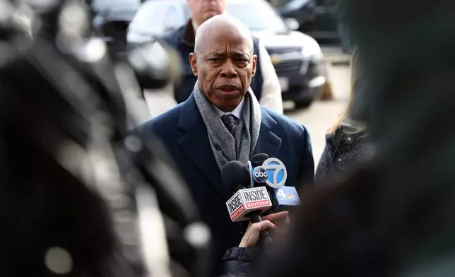 FILE - NYC Mayor Eric Adams speaks to the press after the arrival of Luigi Mangione, a suspect in the fatal shooting of UnitedHealthcare CEO Brian Thompson, Dec. 19, 2024, in New York. (AP Photo/Pamela Smith, File)