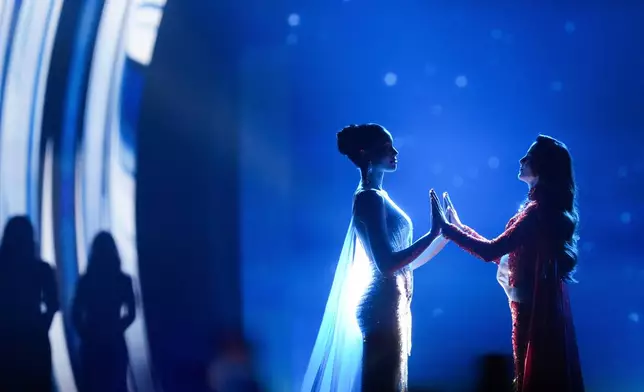 Miss Mexico Fatima Bosch, right, and Miss Thailand Praveenar Singh hold hands while waiting for the announcement of winner for the 2025 Miss Universe pageant in Nonthaburi, north of Bangkok, in Nonthaburi province, Thailand, Friday, Nov. 21, 2025. (AP Photo/Sakchai Lalit, File)