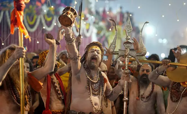 Swami Bhupender Giri, a Naga Sadhu from the Niranjani Akhara, arrives for ritualistic dip at Sangam, the confluence of the Rivers Ganges, Yamuna and mythical Saraswati, on the auspicious Makar Sankranti day during the Maha Kumbh festival, which is one of the world's largest religious gatherings, in Prayagraj, in the northern Indian state of Uttar Pradesh, India, Tuesday, Jan. 14, 2025. (AP Photo/Rajesh Kumar Singh, file)