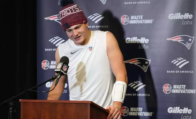 New England Patriots quarterback Drake Maye talks during a news conference after his team defeated the New York Jets in an NFL football game, Sunday, Dec. 28, 2025, in East Rutherford, N.J. (AP Photo/Frank Franklin)