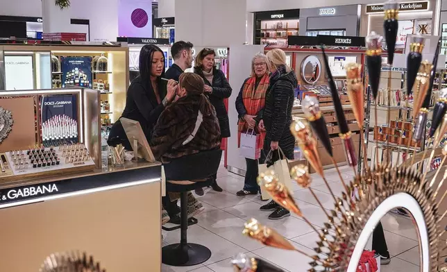 A woman has makeup applied at a Nordstrom department store, in New York, Monday, Dec. 8, 2025. (AP Photo/Richard Drew)