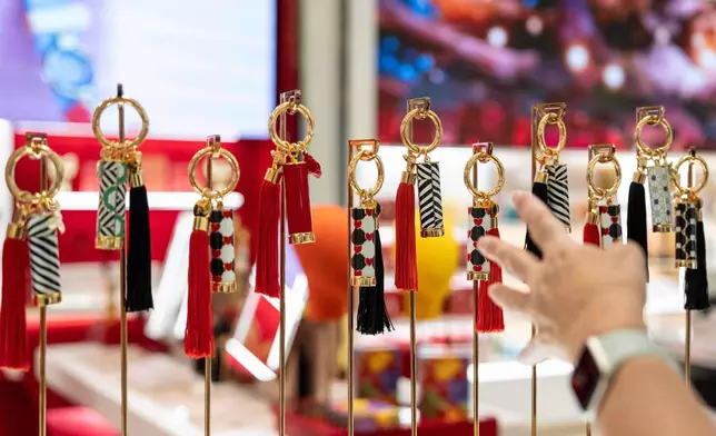 Cosmetics products by Carolina Herrera are displayed at Macy's flagship store, Friday, Nov. 21, 2025, in New York. (AP Photo/Yuki Iwamura)