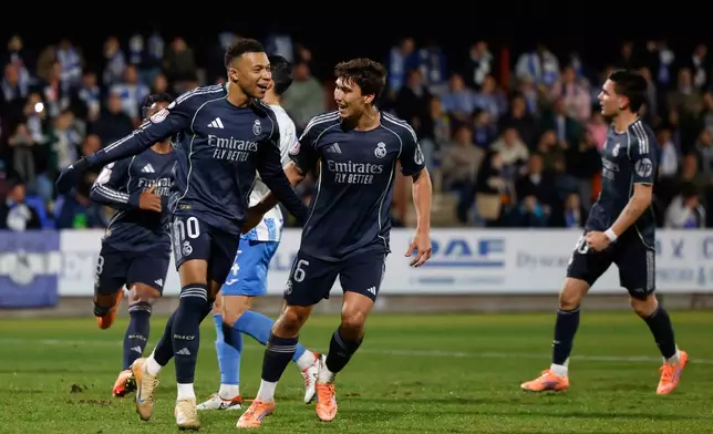 Real Madrid's Kylian Mbappe celebrates after scoring from a penalty kick during the Copa del Rey soccer match between Talavera and Real Madrid, in Talavera de la Reina, Spain, Wednesday, Dec. 17, 2025. (AP Photo/M. Berengui)