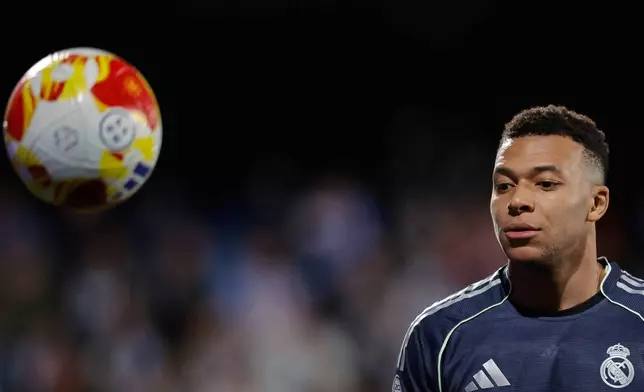 Real Madrid's Kylian Mbappe reacts during the Copa del Rey soccer match between Talavera and Real Madrid, in Talavera de la Reina, Spain, Wednesday, Dec. 17, 2025. (AP Photo/M. Berengui)