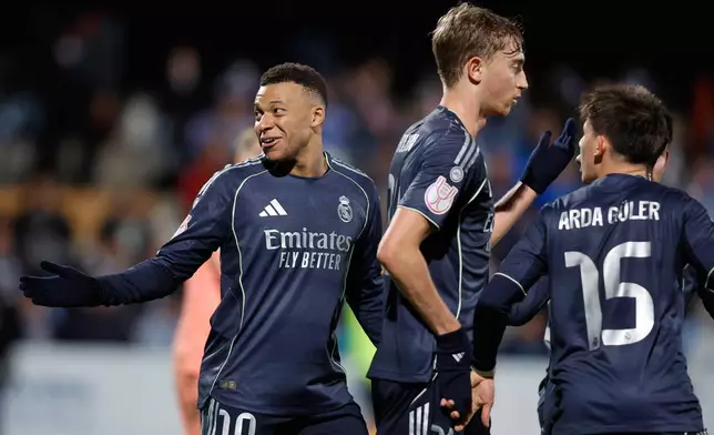 Real Madrid's Kylian Mbappe celebrates after scoring from a penalty kick during the Copa del Rey soccer match between Talavera and Real Madrid, in Talavera de la Reina, Spain, Wednesday, Dec. 17, 2025. (AP Photo/M. Berengui)