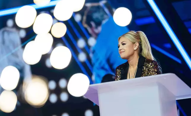 Erika Kirk speaks during Turning Point USA's AmericaFest 2025, Thursday, Dec. 18, 2025, in Phoenix. (AP Photo/Jon Cherry)