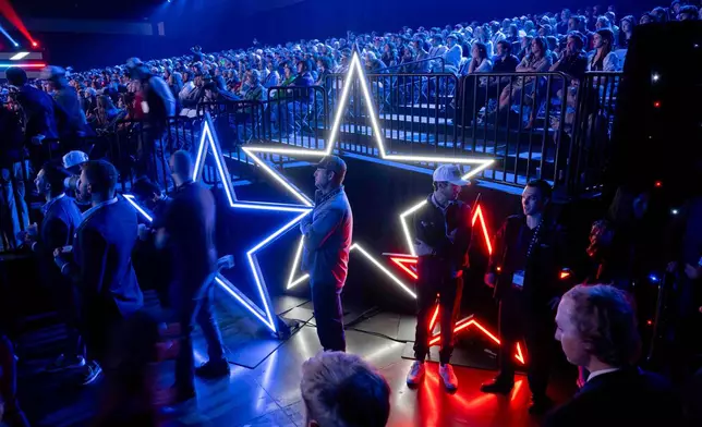 Attendees line up for the VIP section during Turning Point USA's AmericaFest 2025, Thursday, Dec. 18, 2025, in Phoenix. (AP Photo/Jon Cherry)