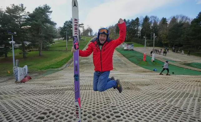 British former ski jumper Michael Edwards, known as Eddie the Eagle, poses for a photo at the Ski and Snowboard Center, in Gloucester, England, Wednesday, Nov. 19, 2025. (AP Photo/Frank Augstein)