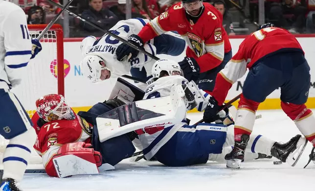Florida Panthers goaltender Sergei Bobrovsky (72) falls to the ice as he defends the goal during the first period of an NHL hockey game against the Toronto Maple Leafs, Tuesday, Dec. 2, 2025, in Sunrise, Fla. (AP Photo/Lynne Sladky)