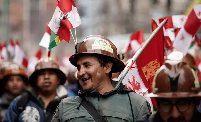 Miners march to protest President Rodrigo Paz's decision to remove fuel subsidies in La Paz, Bolivia Monday, Dec. 22, 2025. (AP Photo/Freddy Barragan)