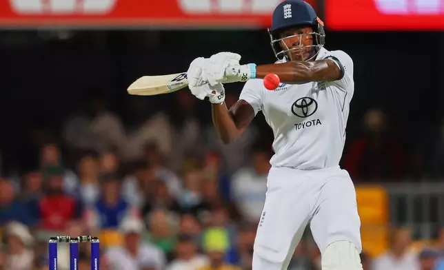 England's Jofra Archer plays a shot during the second Ashes cricket test match between Australia and England in Brisbane, Thursday, Dec. 4, 2025.. (AP Photo/Tertius Pickard)