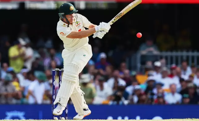 Australia's Marnus Labuschagne plays a shot during the second Ashes cricket test match between Australia and England in Brisbane, Friday, Dec. 5, 2025.. (AP Photo/Tertius Pickard)