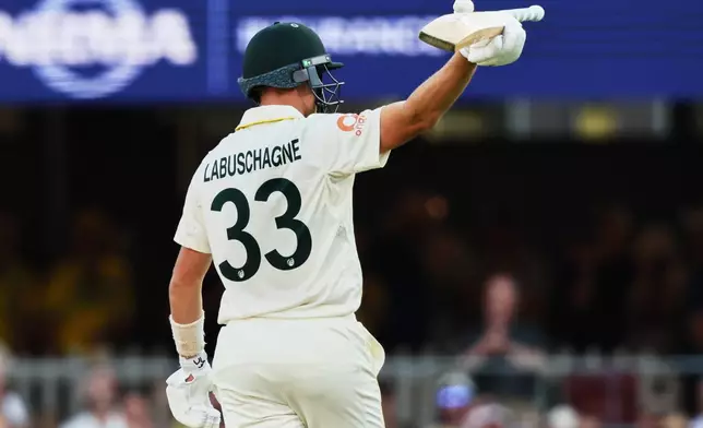 Australia's Marnus Labuschagne celebrates his fifty runs during the second Ashes cricket test match between Australia and England in Brisbane, Friday, Dec. 5, 2025.. (AP Photo/Tertius Pickard)