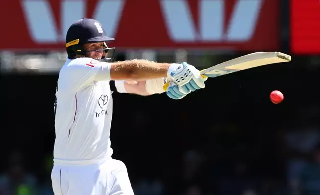 England's Joe Root plays a shot during the second Ashes cricket test match between Australia and England in Brisbane, Friday, Dec. 5, 2025.. (AP Photo/Tertius Pickard)