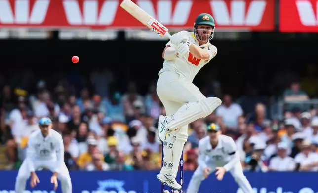 Australia's Travis Head plays a shot during the second Ashes cricket test match between Australia and England in Brisbane, Friday, Dec. 5, 2025.. (AP Photo/Tertius Pickard)