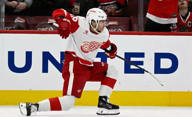 Detroit Red Wings right wing Patrick Kane reacts after he scores a goal during the first period of an NHL hockey game against the Chicago Blackhawks, Saturday, Dec. 13, 2025, in Chicago. (AP Photo/Matt Marton)