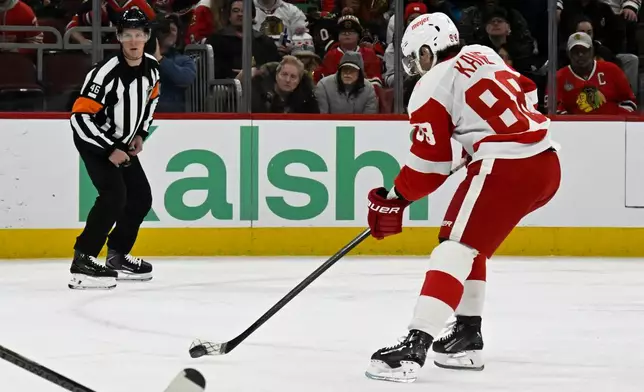 Detroit Red Wings right wing Patrick Kane scores a goal during the first period of an NHL hockey game against the Chicago Blackhawks, Saturday, Dec. 13, 2025, in Chicago. (AP Photo/Matt Marton)