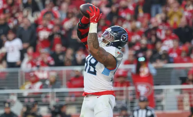 Tennessee Titans defensive tackle Jeffery Simmons (98) makes a touchdown catch in the end zone during the second half of an NFL football game against the San Francisco 49ers, Sunday, Dec. 14, 2025, in Santa Clara, Calif. (AP Photo/Jed Jacobsohn)