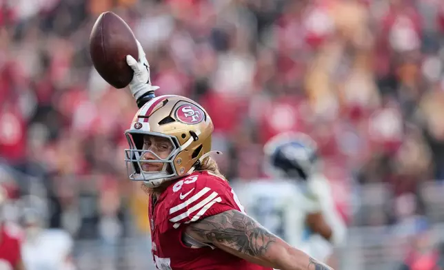 San Francisco 49ers tight end George Kittle (85) celebrates his touchdown during the second half of an NFL football game against the Tennessee Titans, Sunday, Dec. 14, 2025, in Santa Clara, Calif. (AP Photo/Godofredo A. Vásquez)