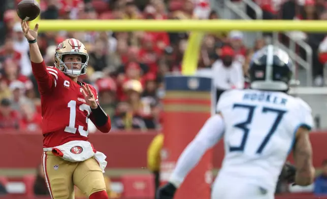 San Francisco 49ers quarterback Brock Purdy (13) throws a pass during the first half of an NFL football game against the Tennessee Titans, Sunday, Dec. 14, 2025, in Santa Clara, Calif. (AP Photo/Jed Jacobsohn)