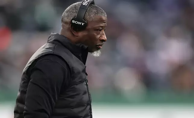 New York Jets head coach Aaron Glenn looks on during the second half of an NFL football game against the New England Patriots, Sunday, Dec. 28, 2025, in East Rutherford, N.J. (AP Photo/Adam Hunger)