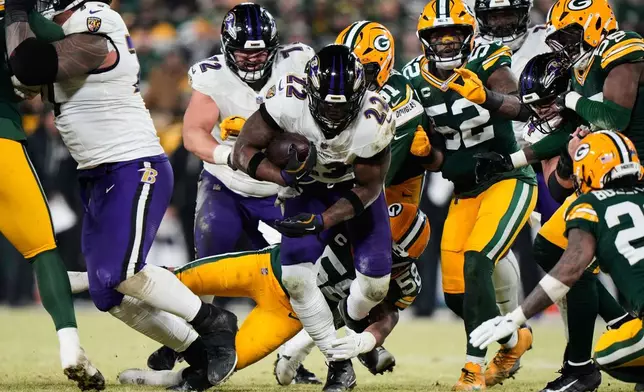 Baltimore Ravens running back Derrick Henry (22) runs the ball against the Green Bay Packers during the second half of an NFL football game, Saturday, Dec. 27, 2025, in Green Bay, Wis. (AP Photo/Morry Gash)