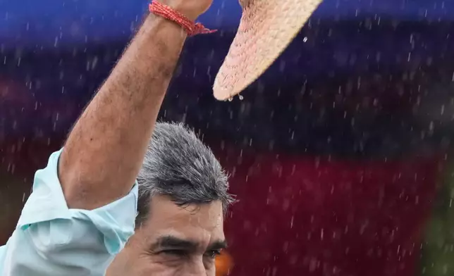 FILE - President Nicolas Maduro addresses supporters during a rally marking the anniversary of the Battle of Santa Ines, which took place during Venezuela's 19th-century Federal War, in Caracas, Venezuela, Wednesday, Dec. 10, 2025. (AP Photo/Ariana Cubillos, File)